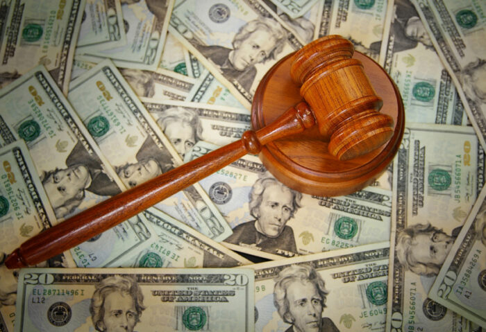 court gavel on U.S. Twenty dollar bills
