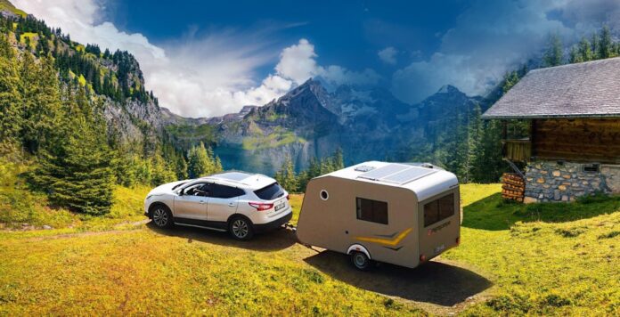 car and caravan in nature