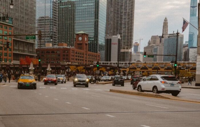 Bustling Chicago street with cars and skyscrapers on a cloudy day